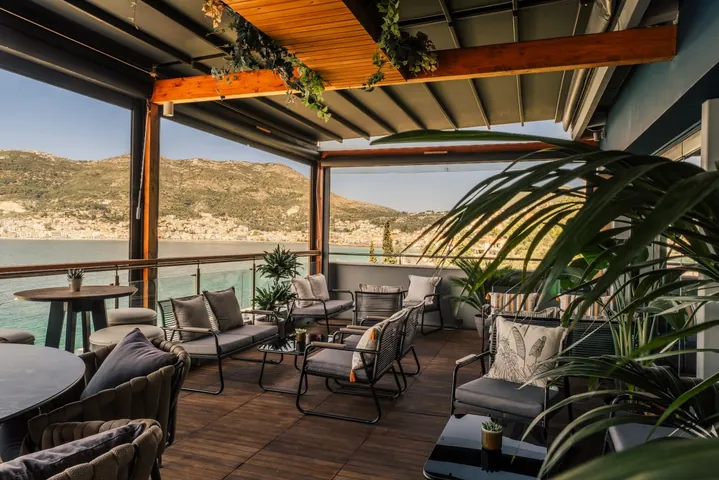 Rooftop lounge at Sirius Samos with panoramic views across Samos harbour